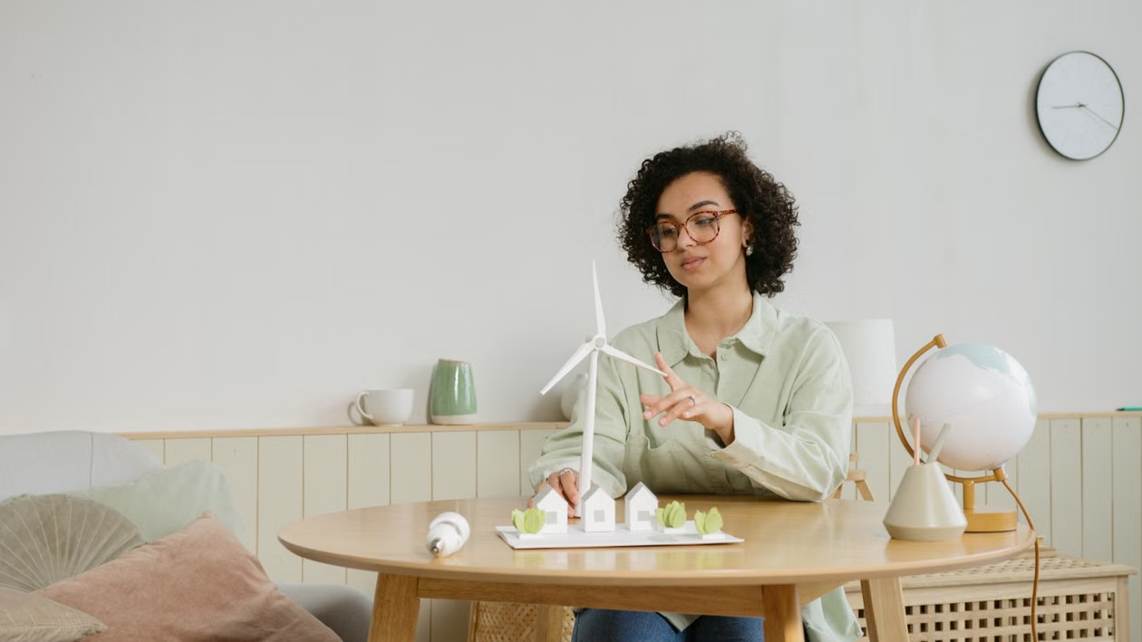woman-holding-a-model-windmill-6990476